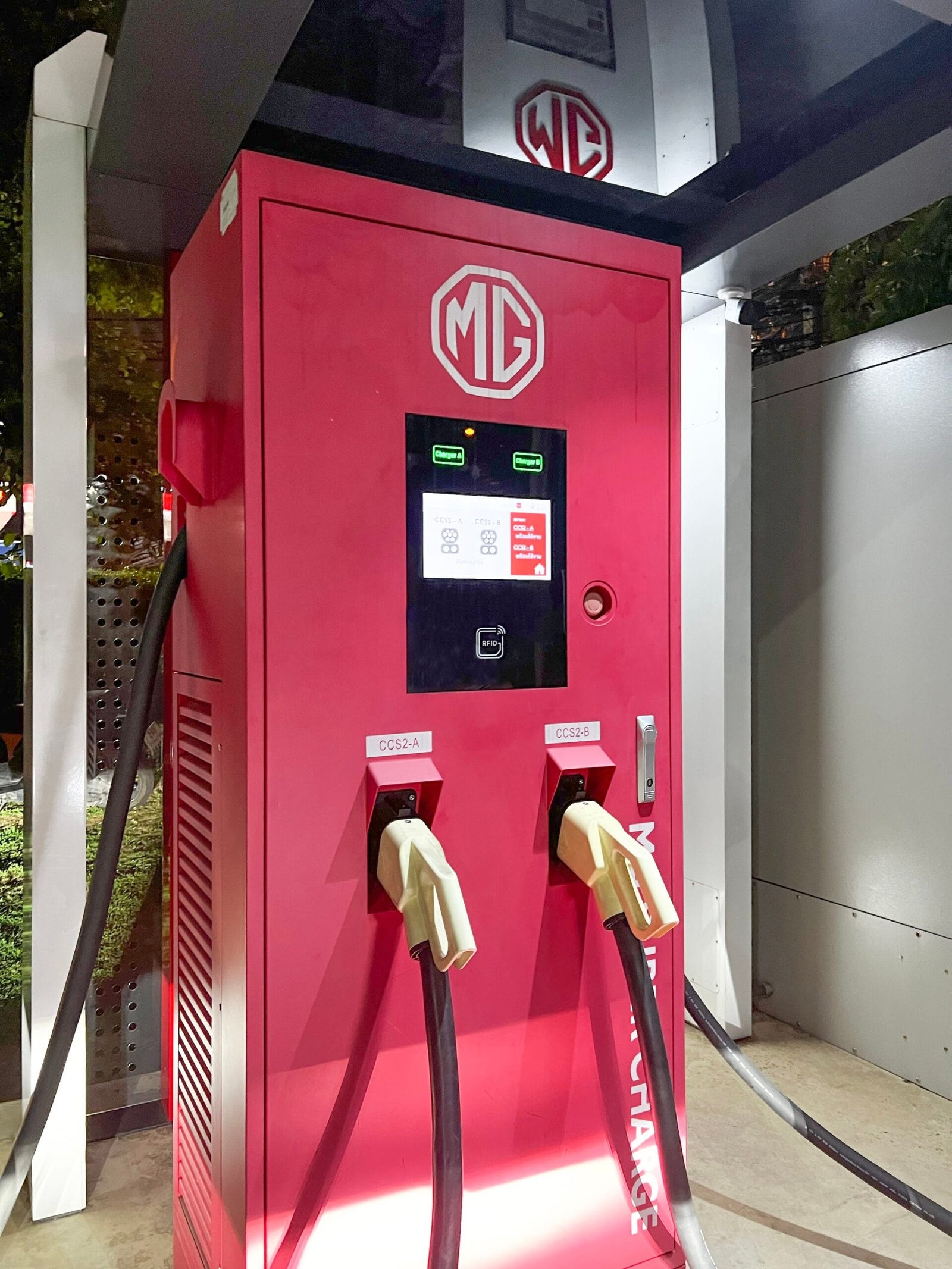 Red MG-branded dual-connector charging cabinet at a Thai installation