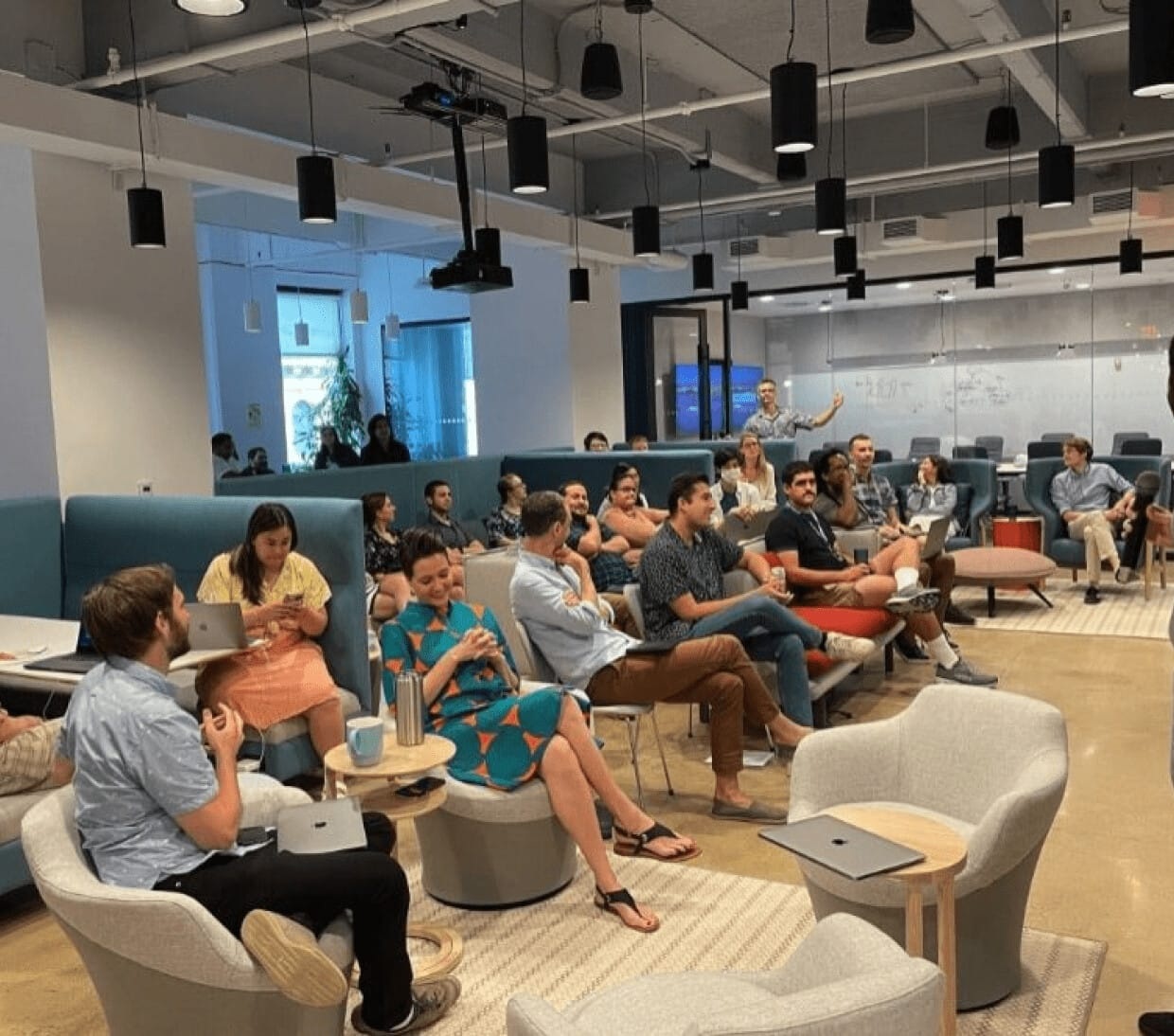 EnergyHub employees gathered in an office seating area