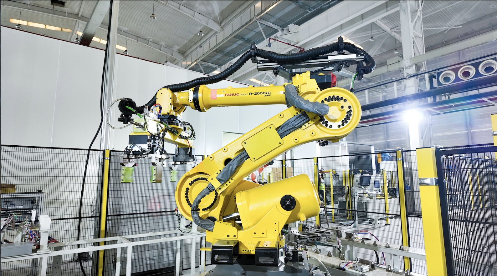 Yellow industrial robot on EnerVenue’s Changzhou production line
