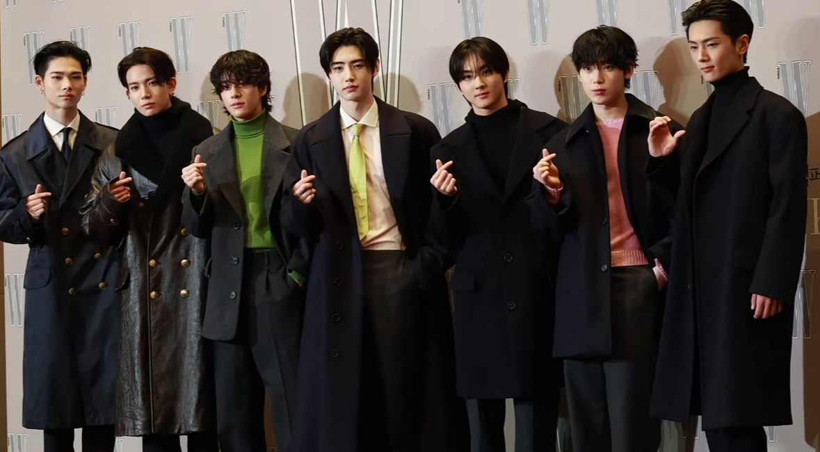 The seven members of ENHYPEN standing together at the Love Your W event in Seoul in October 2024