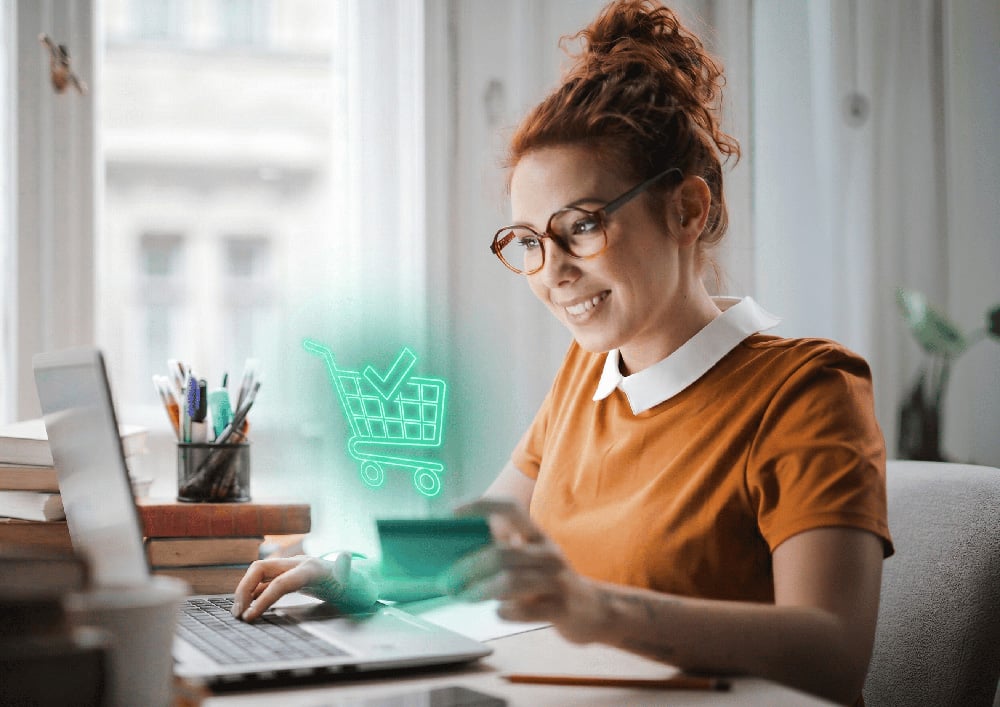 A customer shopping online with a bank card and laptop