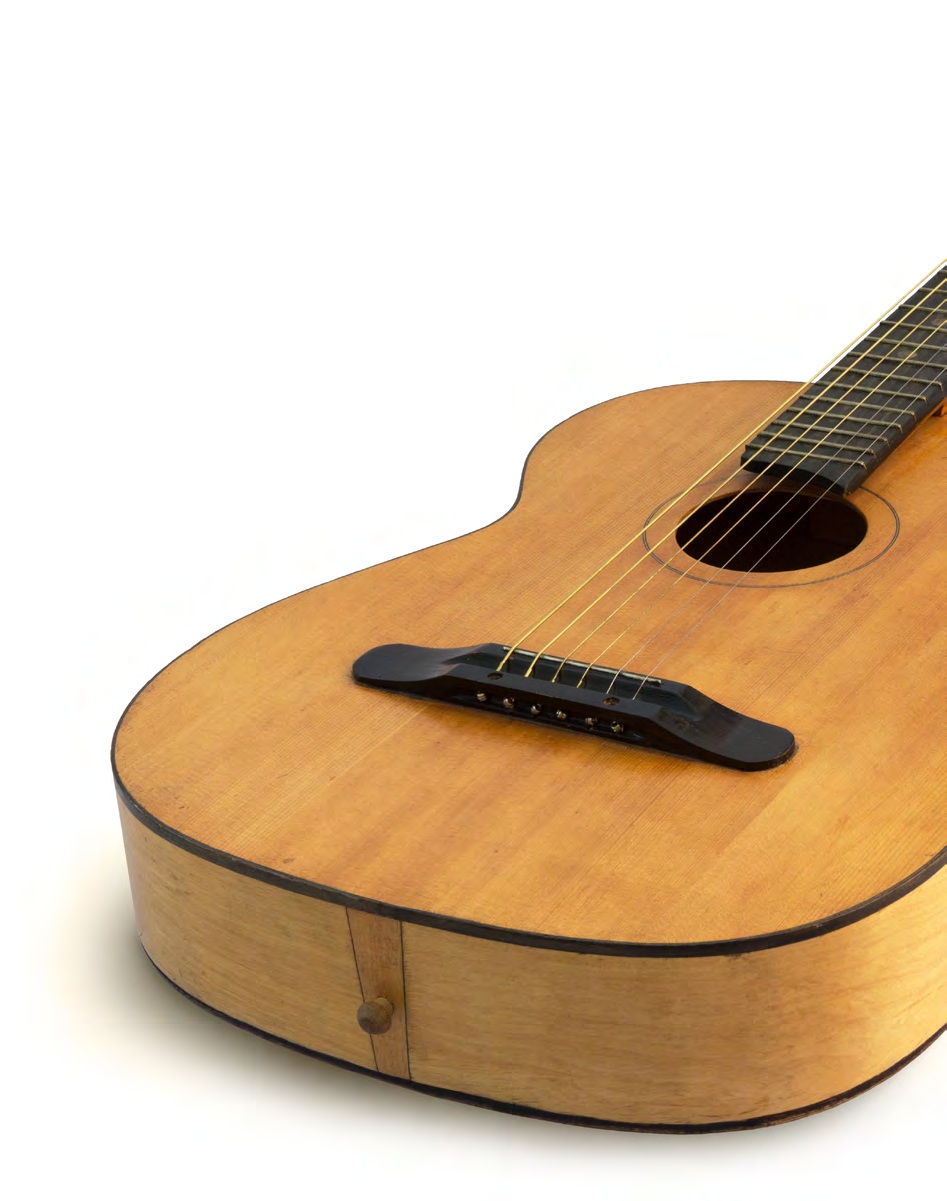 Close view of an acoustic guitar, an illustrative photograph from enVista’s Gibson case study