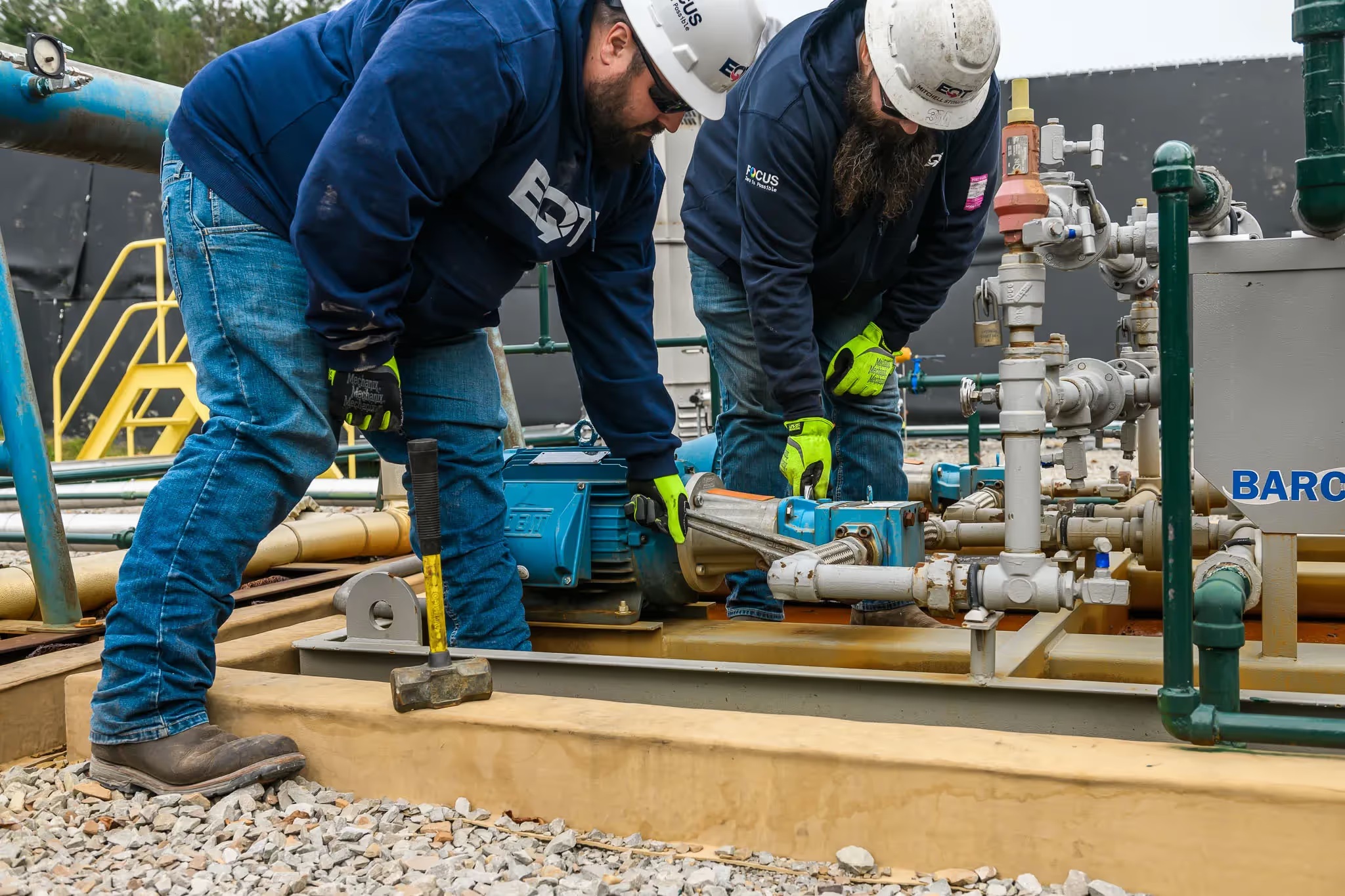 EQT workers together at an operating site
