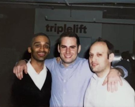 TripleLift co-founders Shaun Zacharia, Ari Lewine and Eric Berry standing together in an early office