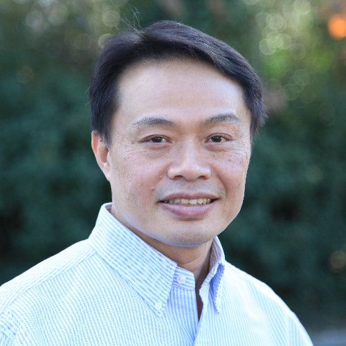 Eric Chen, founder and CEO of Relay2, outdoors in a light collared shirt