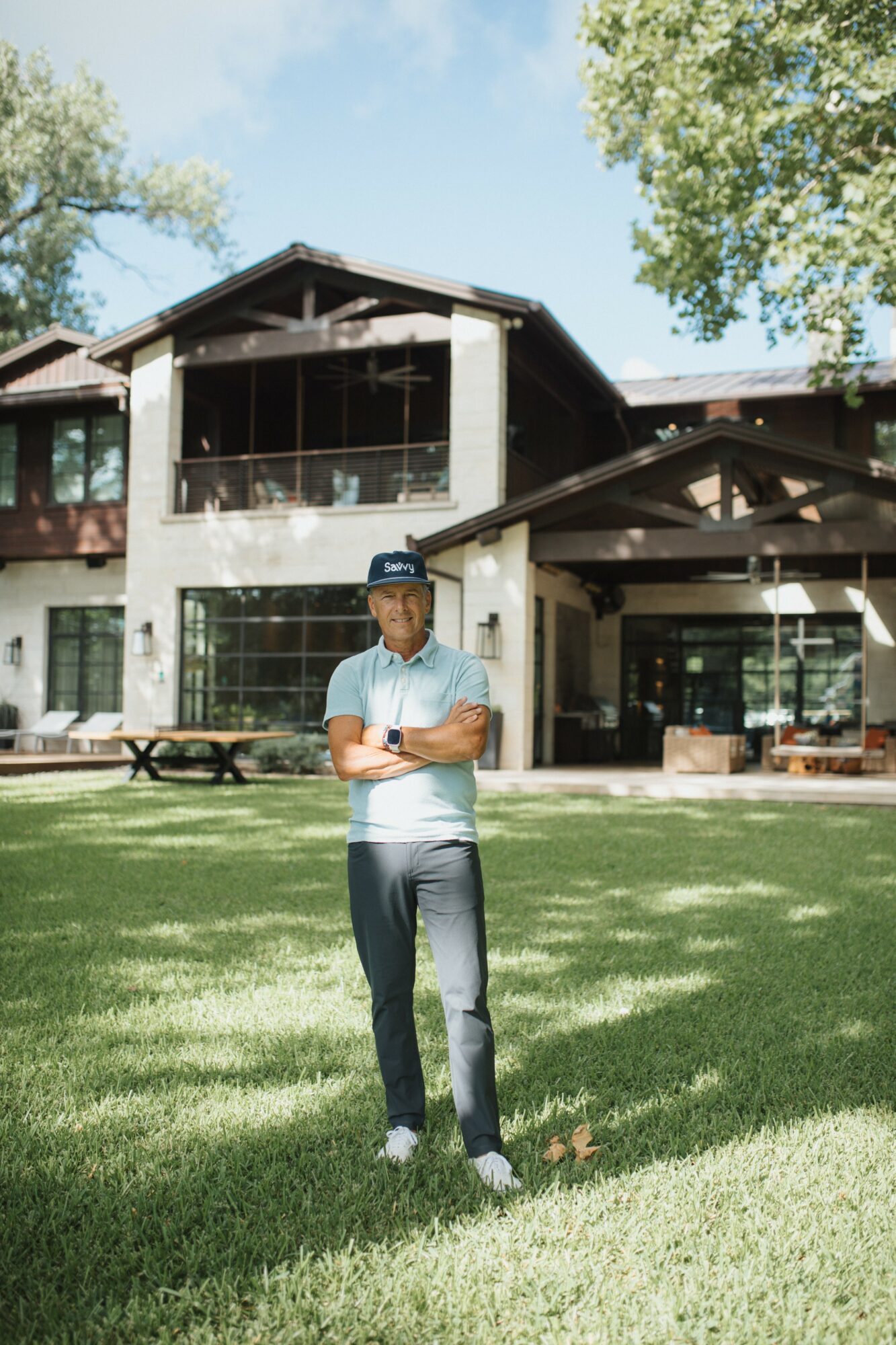 Eric Goldreyer standing on a lawn in front of a lodging property