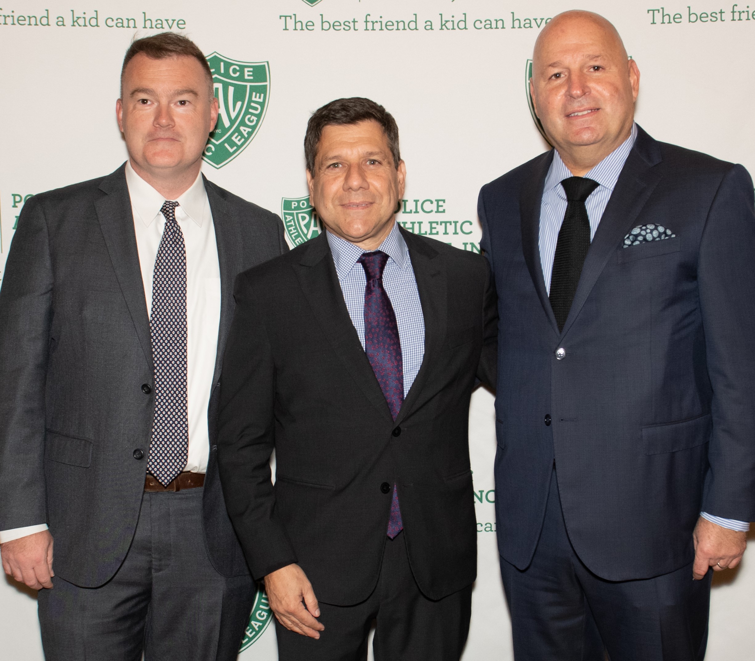 William Gallagher, Eric Hatzimemos and Oliver S. Storch standing together at a Police Athletic League legal event