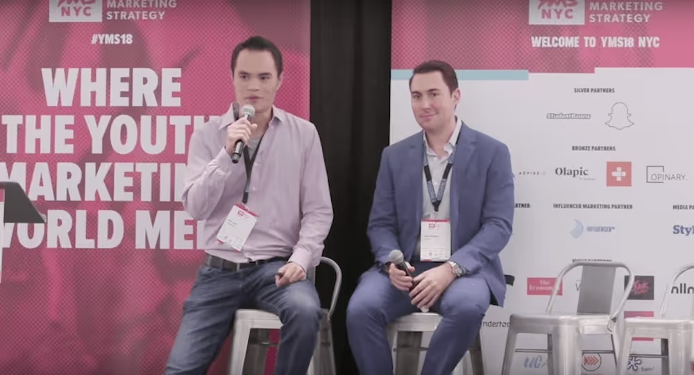 Eric Lam and Zach Beatty seated onstage at YMS18 NYC during a marketing discussion