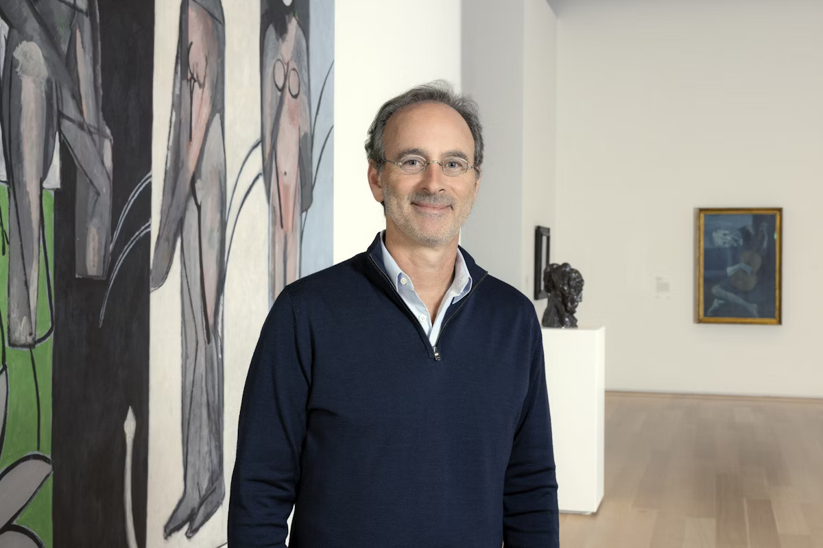Eric Lefkofsky standing beside paintings in a gallery at the Art Institute of Chicago