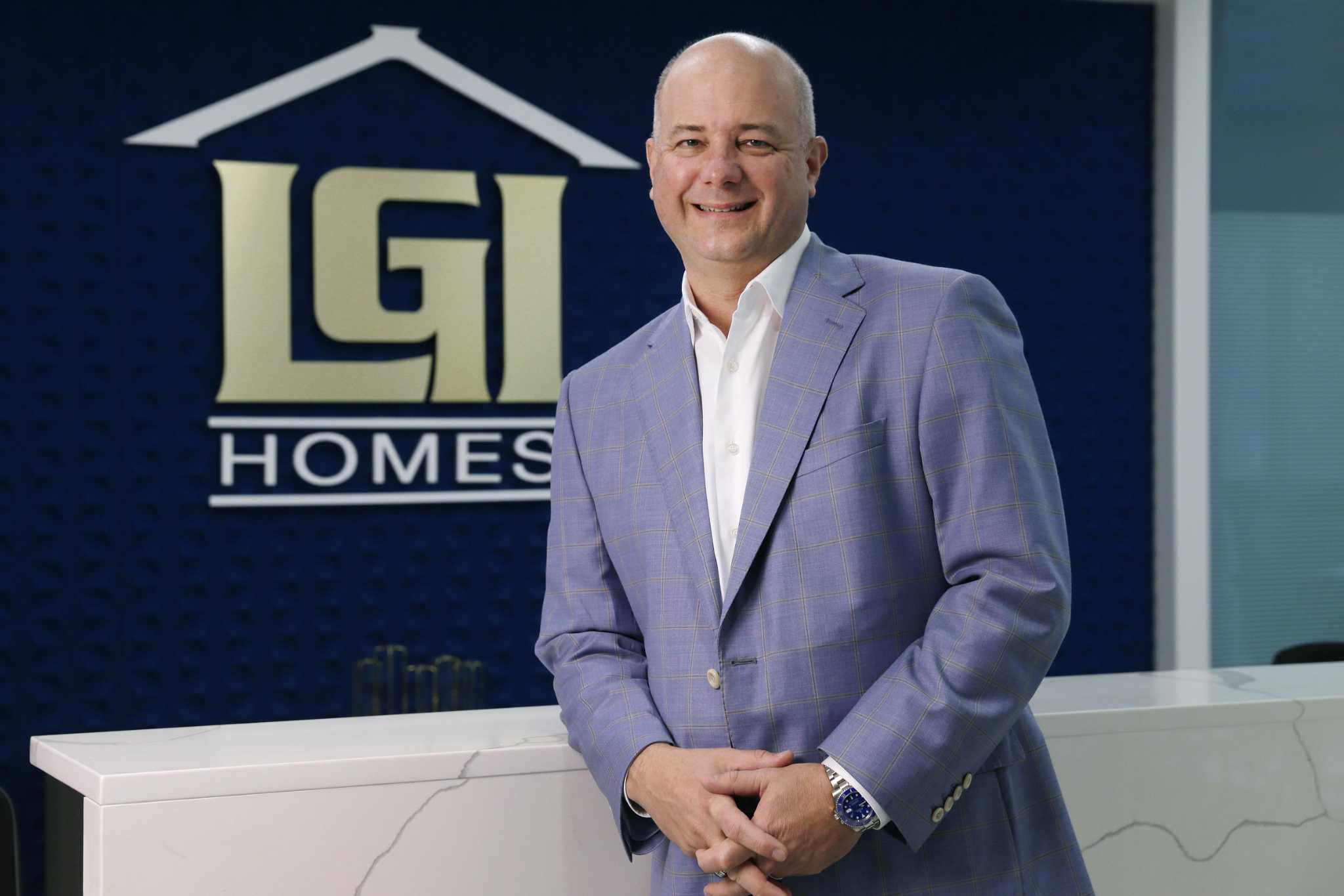 Eric Lipar standing beside a counter at LGI Homes headquarters in The Woodlands