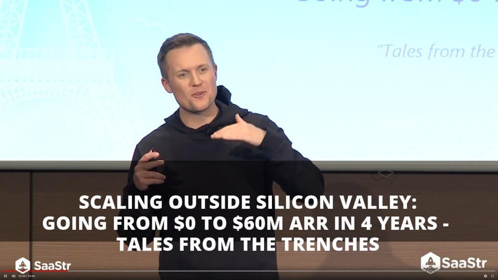 Eric Rea speaking onstage about scaling Podium outside Silicon Valley
