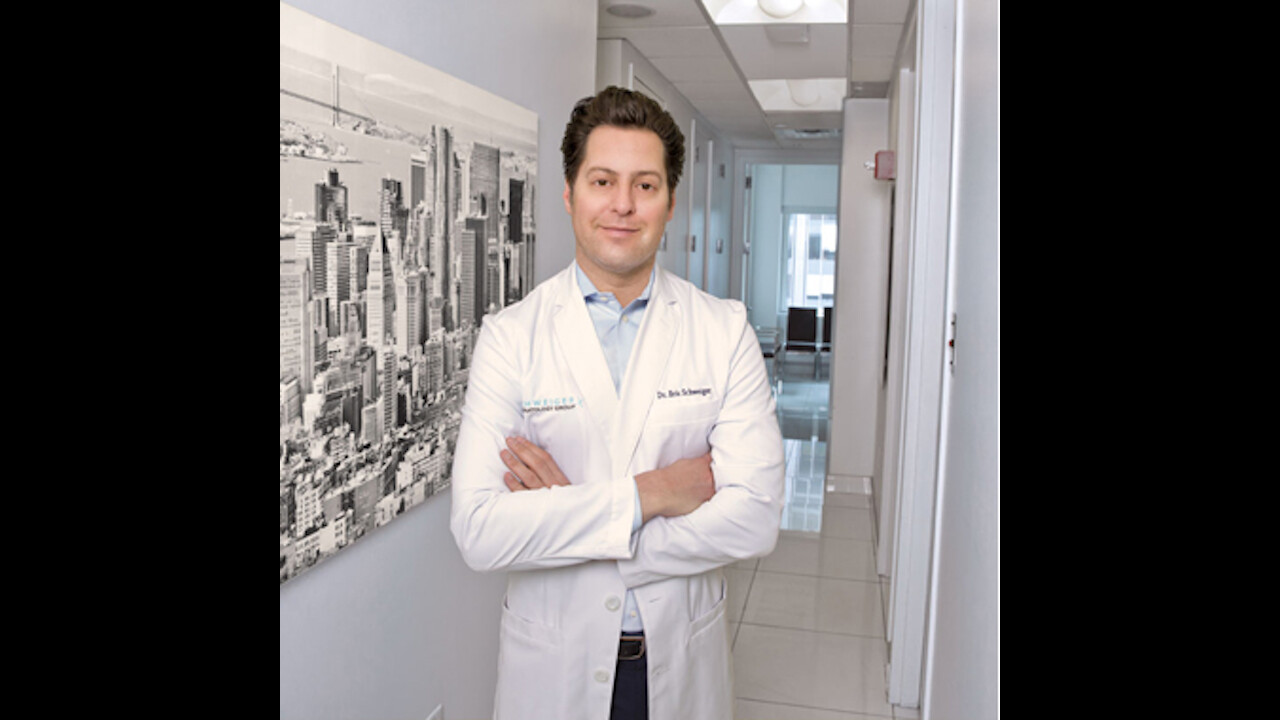Eric Schweiger standing in a hallway at a New York dermatology office