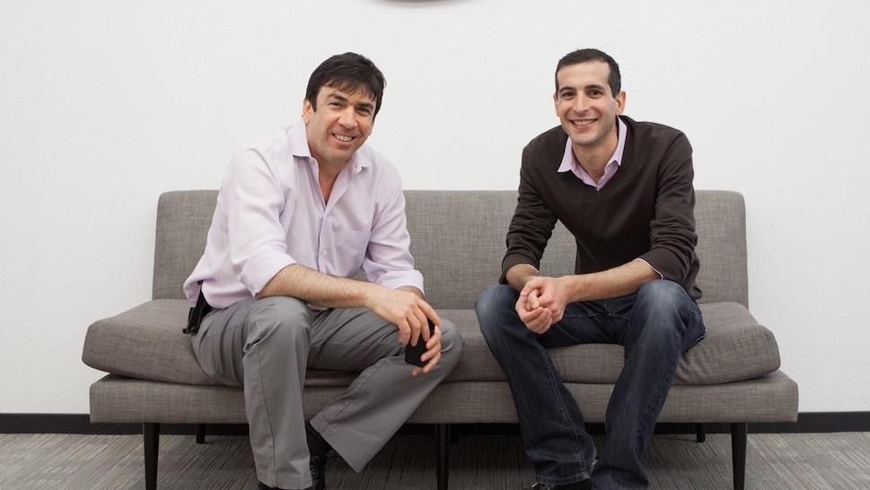 Tango co-founders Uri Raz, left, and Eric Setton, right, seated on a sofa