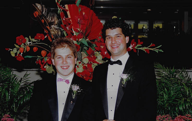 Adam Fingerman, left, and Eric Shapiro wearing tuxedos at a Tufts University formal in 1988