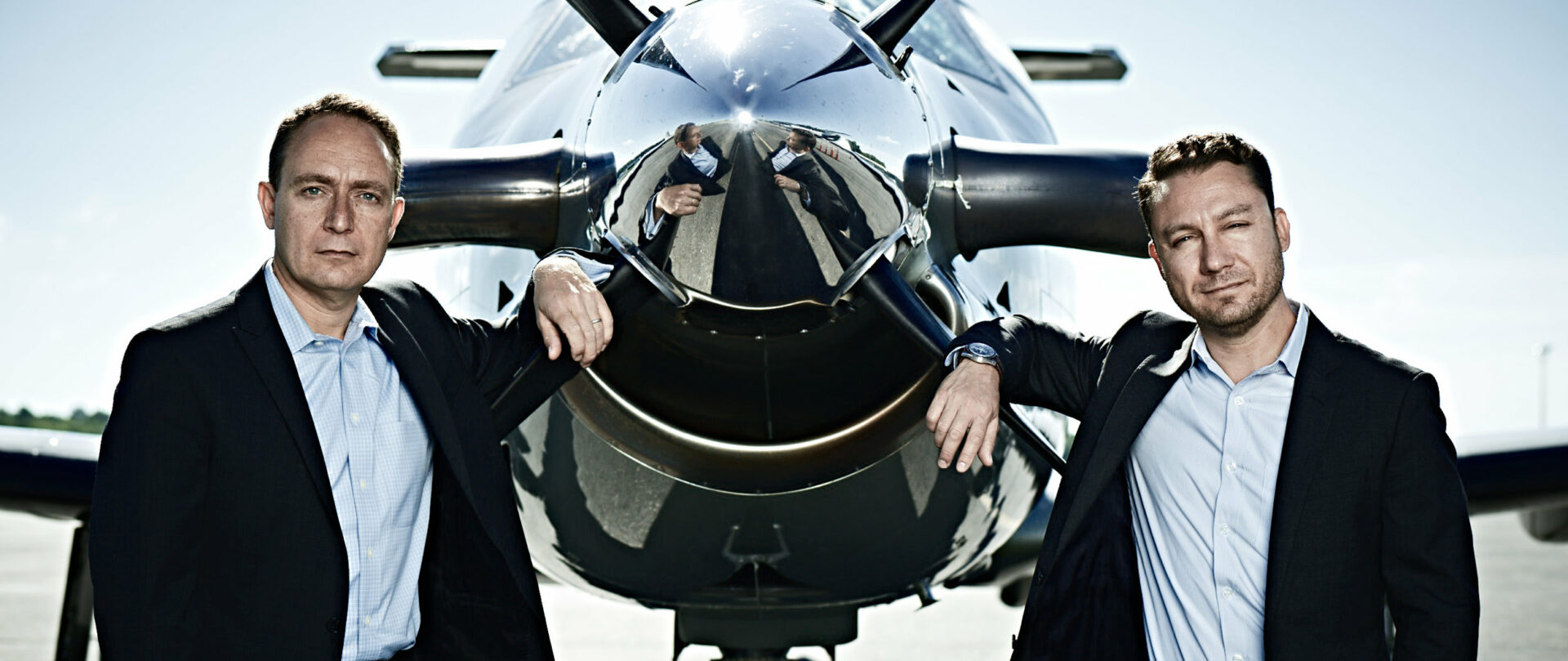 Eric and David Zipkin, co-founders of Tradewind Aviation, beside an aircraft