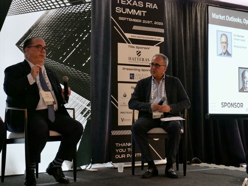 Erick Kuebler, at left holding a microphone, on the Texas RIA Summit panel in September 2023.