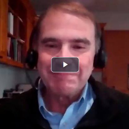 Ernie Crawford wearing headphones in a company-published video still