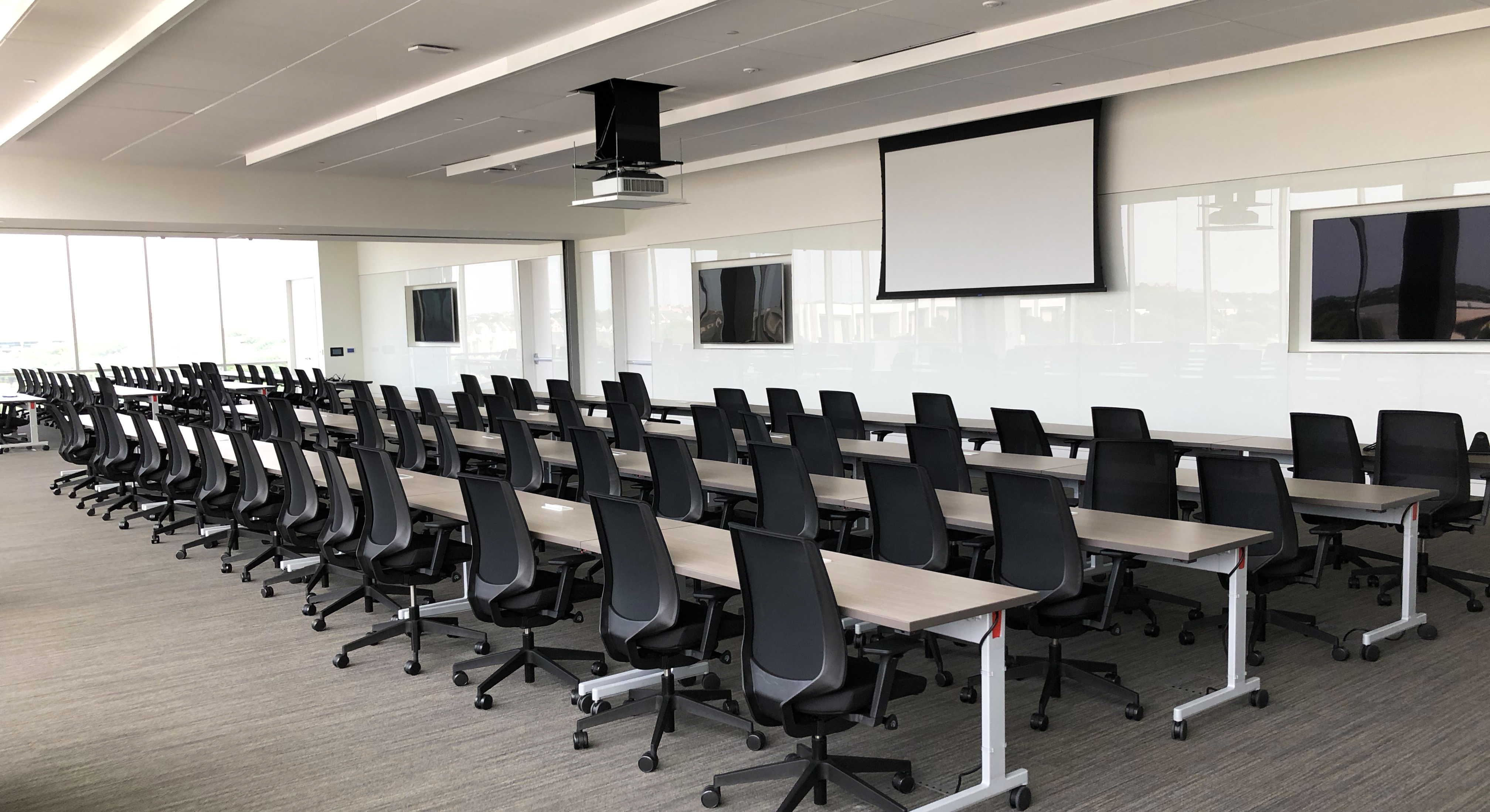 Rows of desks and chairs in an Ethos Group training classroom