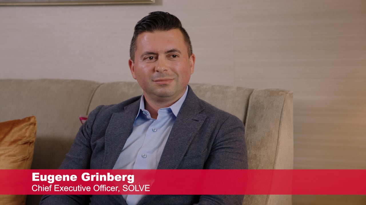 Eugene Grinberg seated during his 2025 TraderTV interview