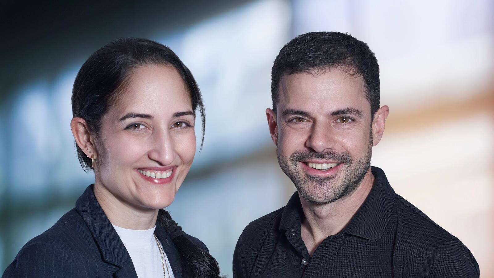 Euno co-founders Sarah Levy and Eyal Firstenberg standing together