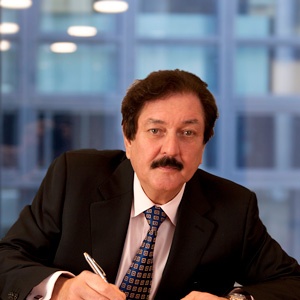 Eurobase co-founder John Wilson seated at a desk