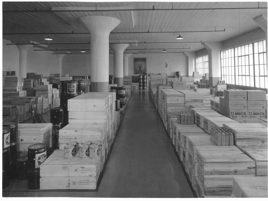 Crates and barrels arranged between columns in the Fort Street warehouse in 1930