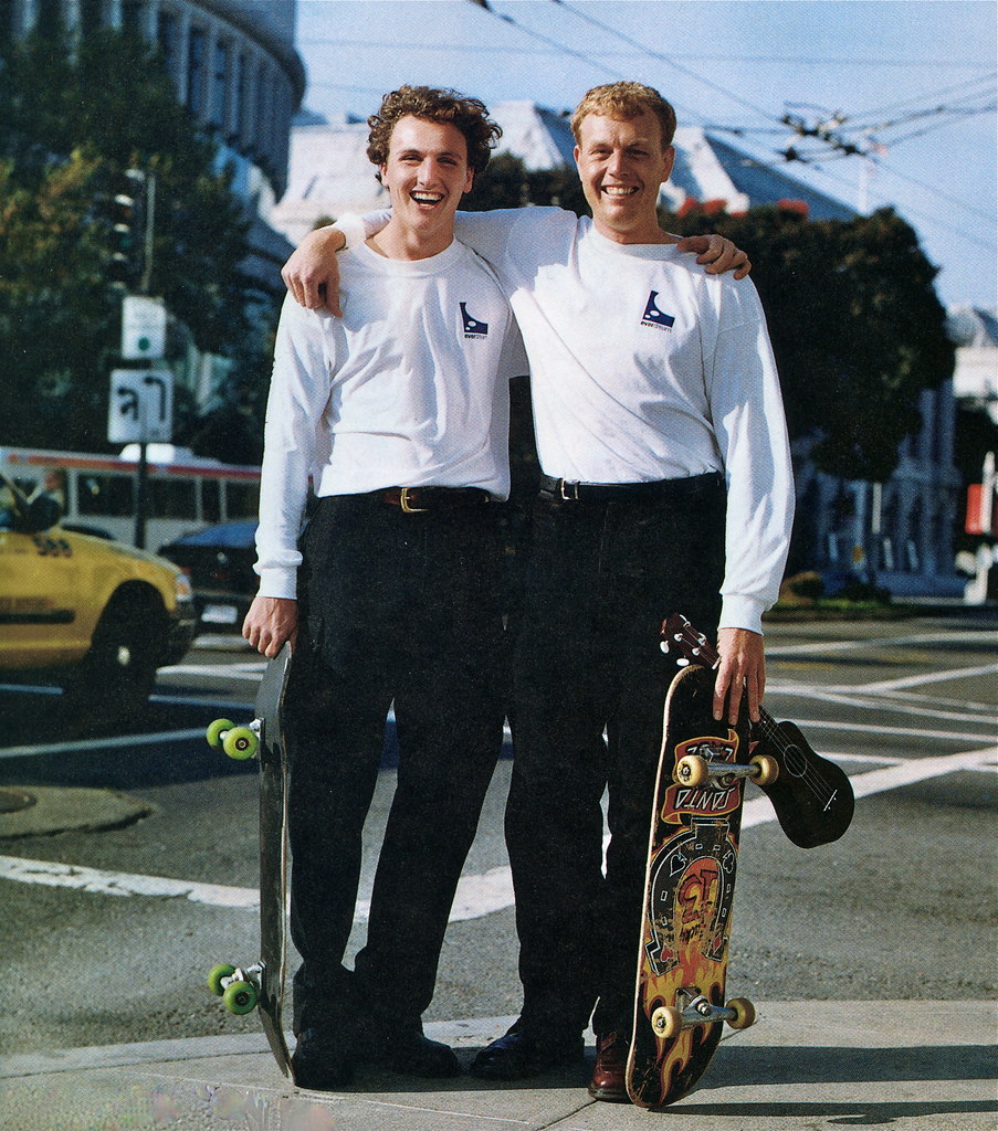 Two Everdream founders standing with skateboards in an archival photograph