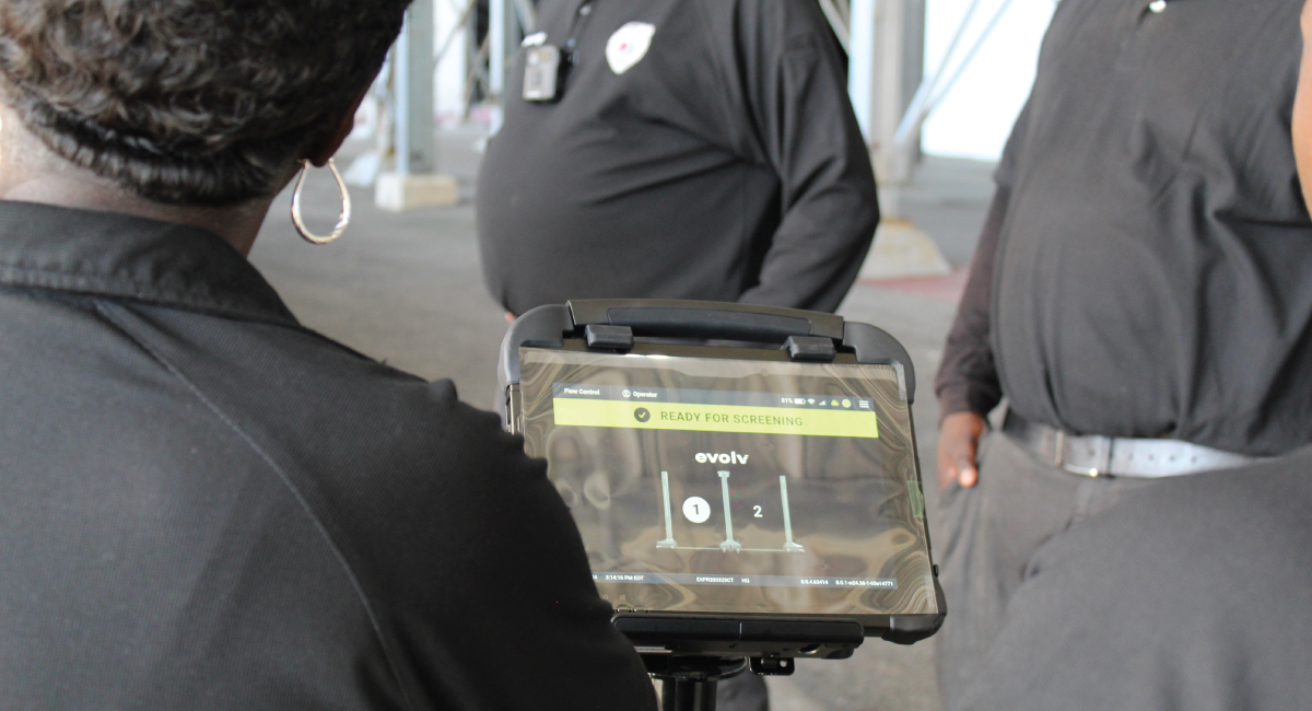 A security team views the Evolv Express screening interface on a rugged tablet
