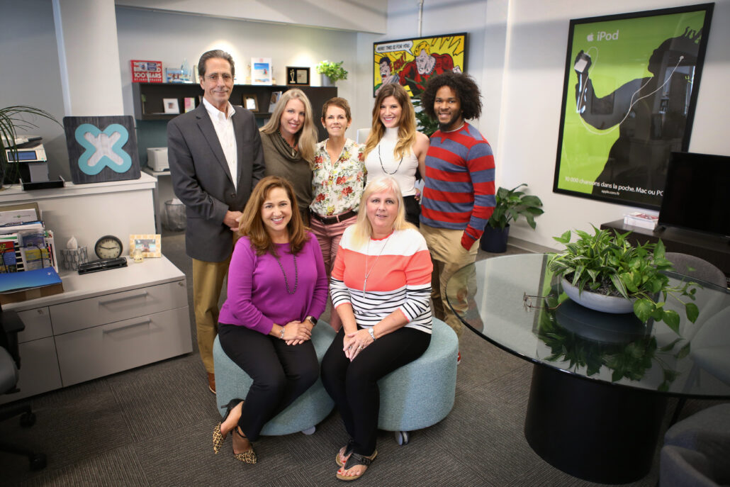 Seven members of the EW Bullock team in their office