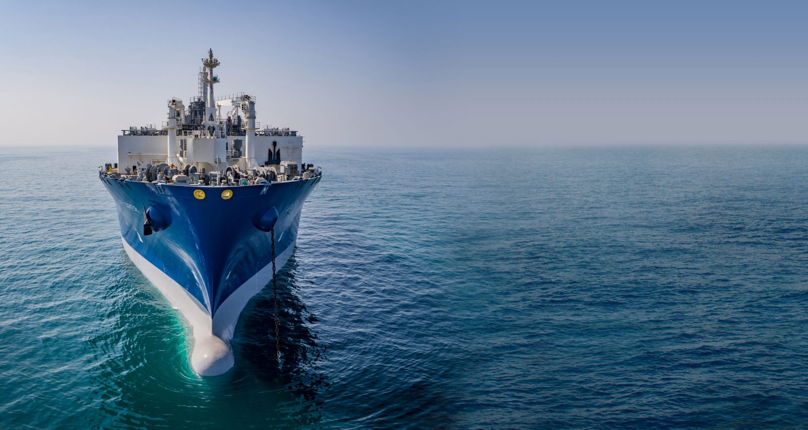 An Excelerate floating storage and regasification vessel seen bow-on at sea
