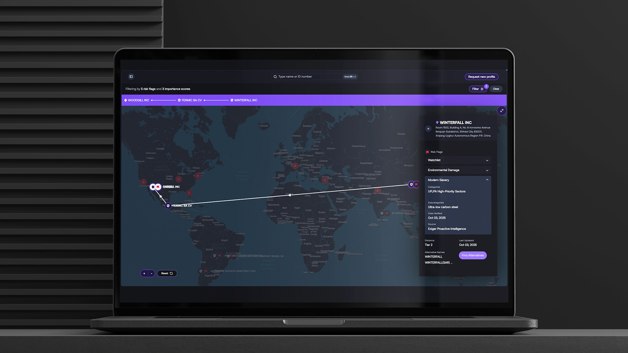 The 1Exiger platform displayed on a laptop, mapping supplier connections and modern-slavery risk across several countries
