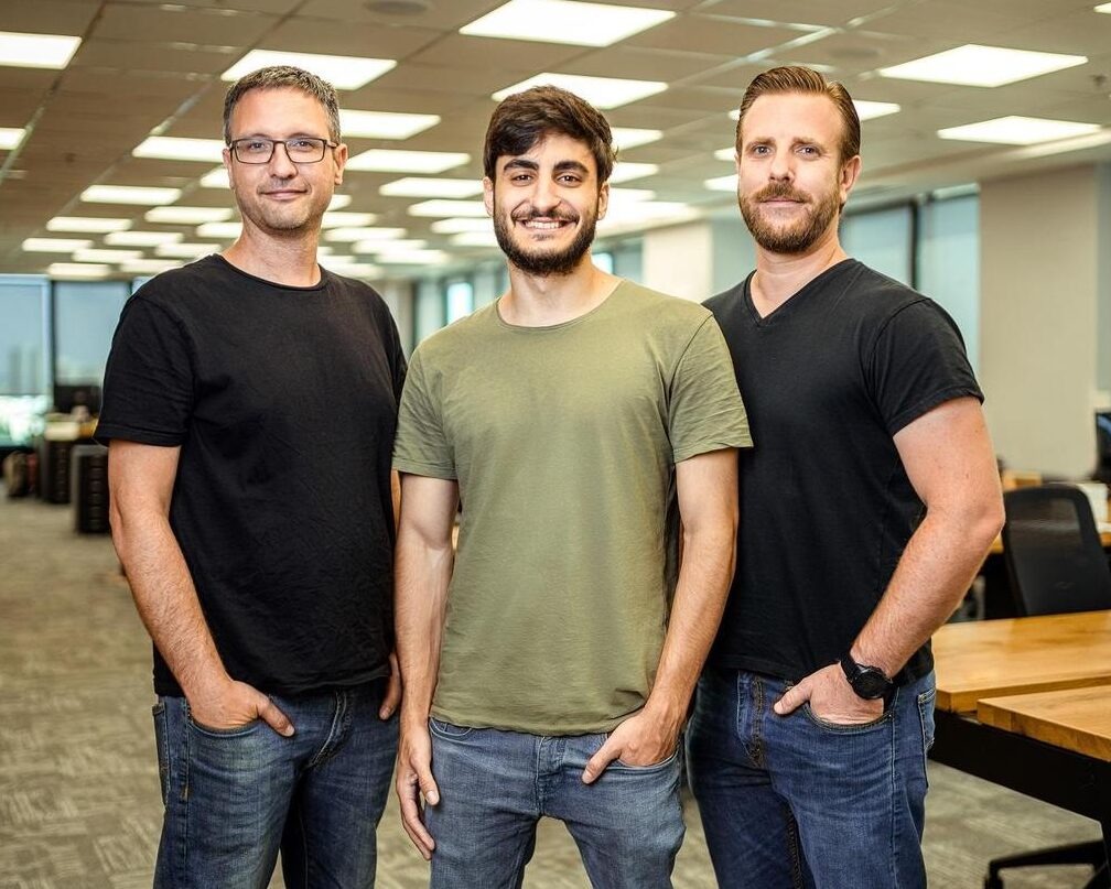 Explorium co-founders Maor Shlomo, Or Tamir and Omer Har standing in an office