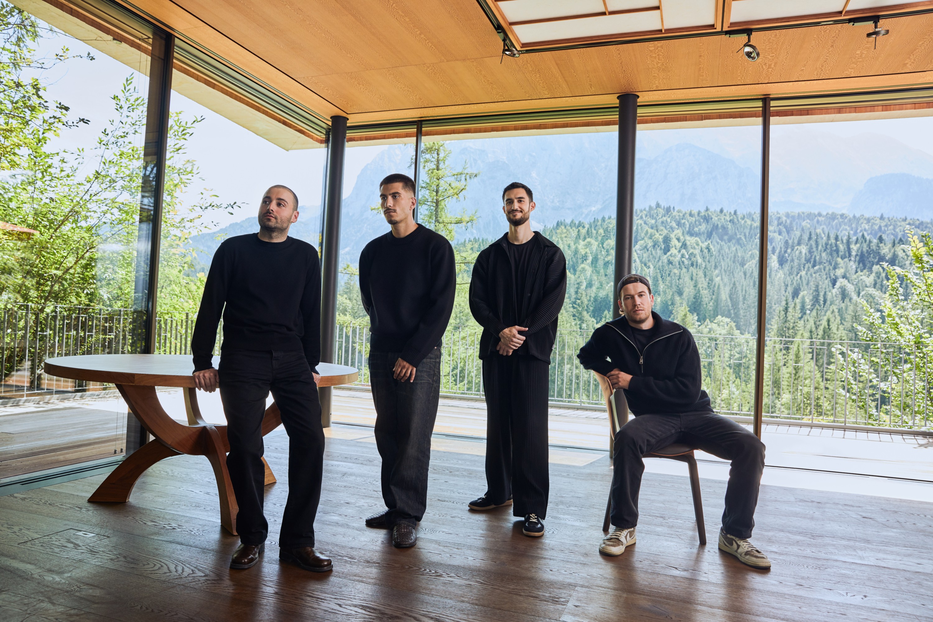 Born team members Baran Yildirim, Fabian Kamberi, Jannis Ringwald and Stefan Quernhorst in a room overlooking mountains