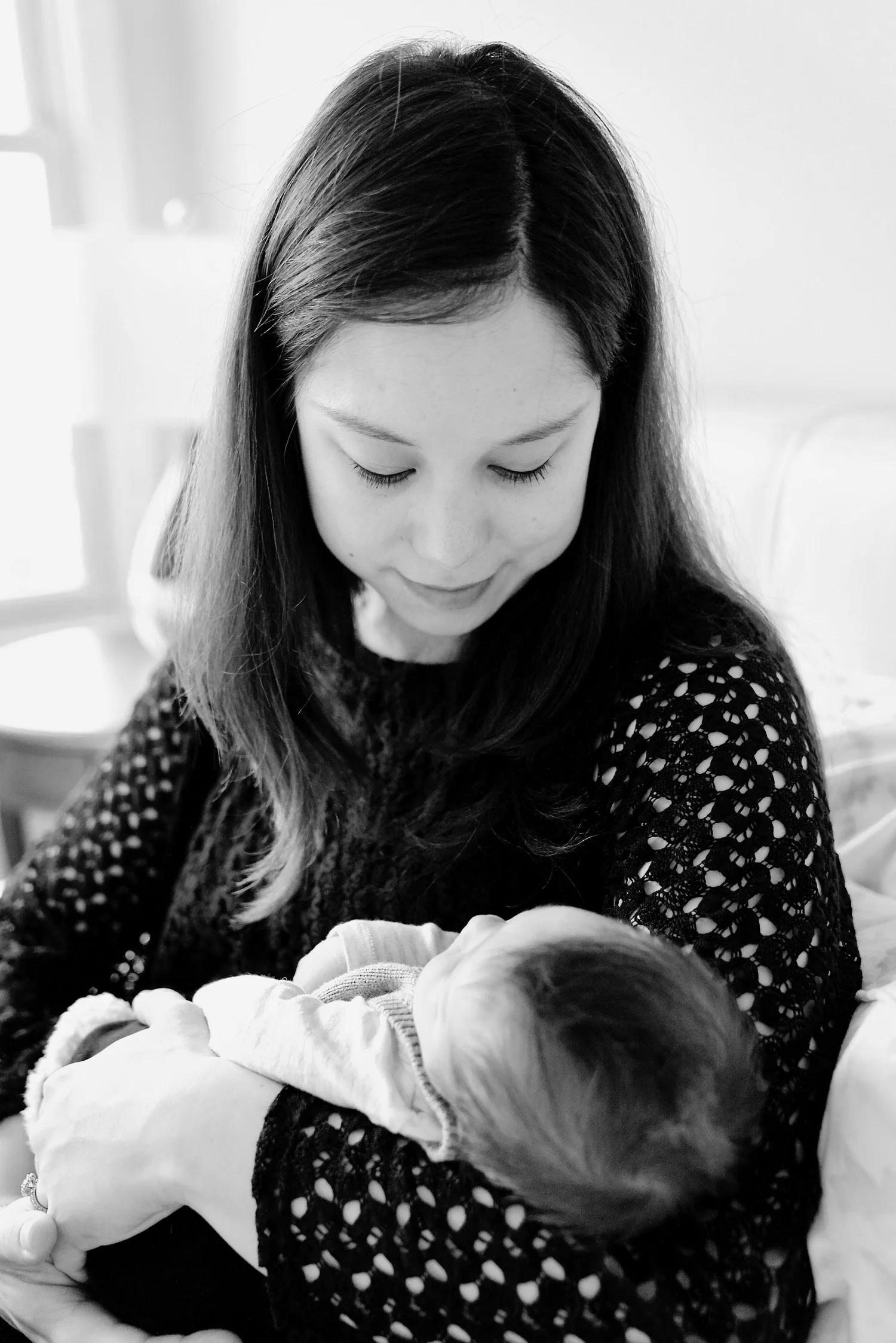 FamilyWell founder Dr. Jessica Gaulton holding her newborn son Will