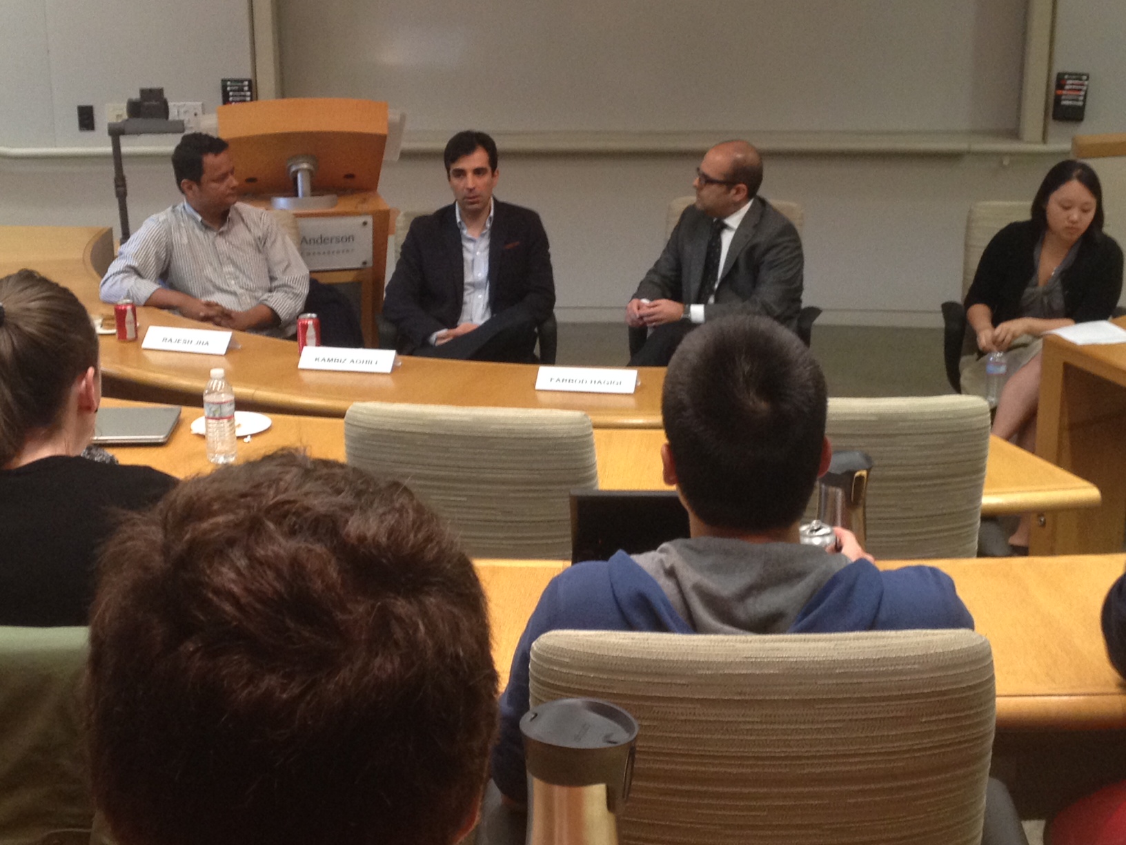 Farbod Hagigi seated on a UCLA Anderson technology panel with fellow panelists and a moderator