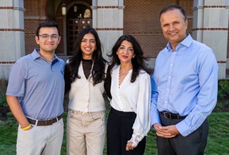 Faraz, Zoya, Asha and Farid Virani standing together on the Rice campus