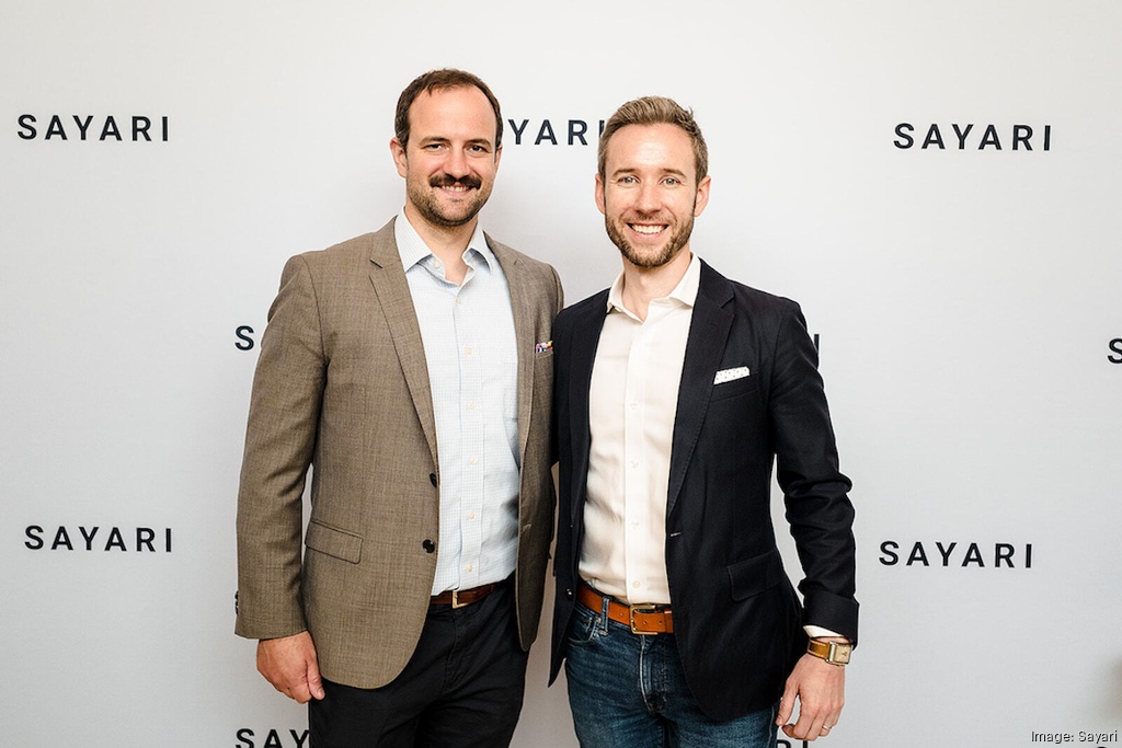 Farley Mesko, left, and fellow Sayari co-founder Benjamin Power standing together at a company event