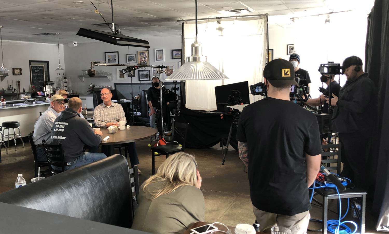 Farm Journal Studios production crew filming a conversation around a table