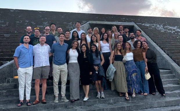 Members of the Fay team standing together on stone steps