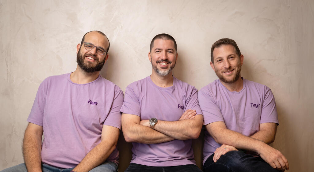 Three Faye team members seated together wearing purple Faye shirts
