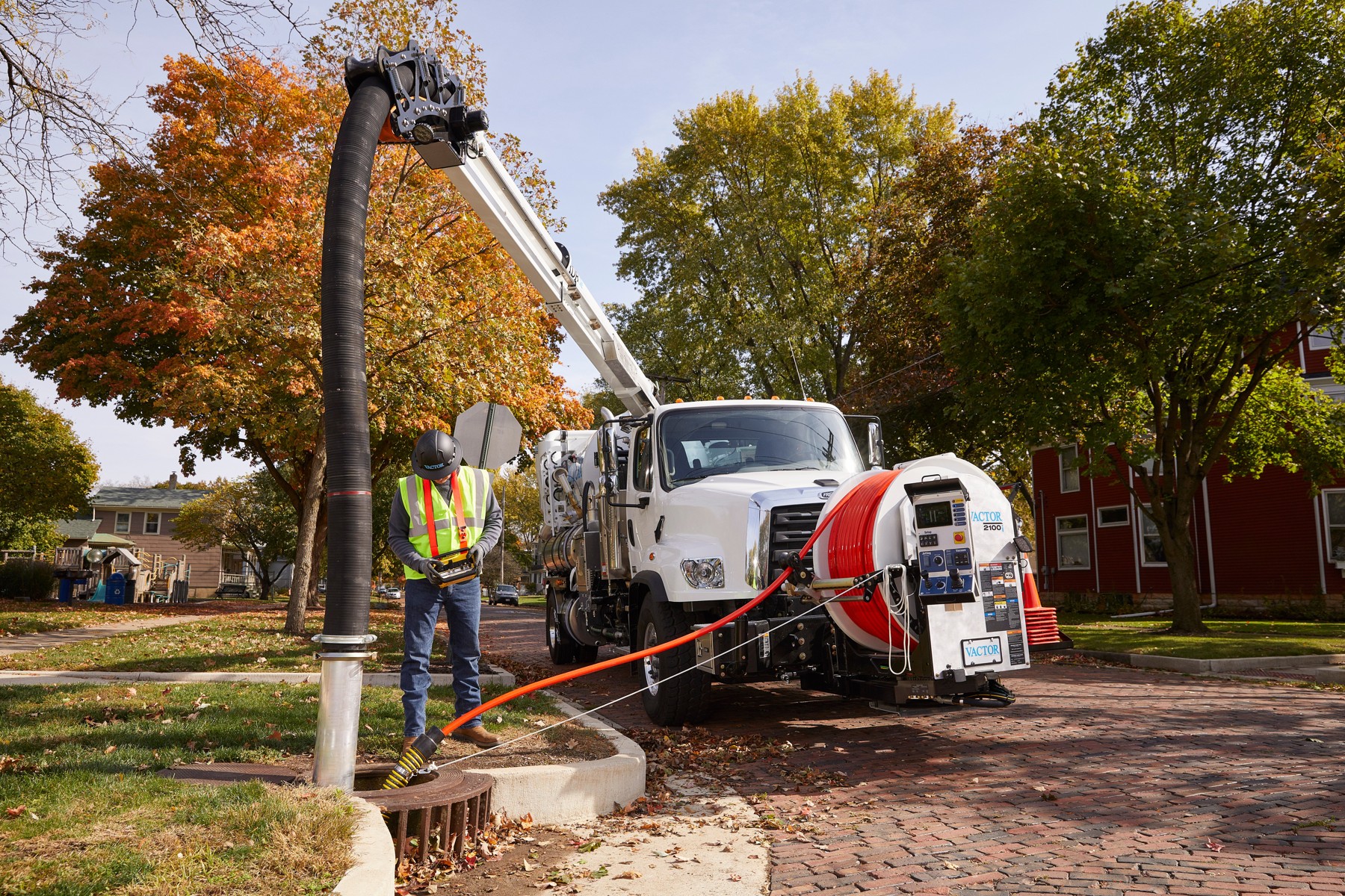Vactor sewer cleaning truck working beside a road