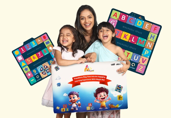 Magik Mat promotional photograph showing a parent, two children and the product’s alphabet and number mats