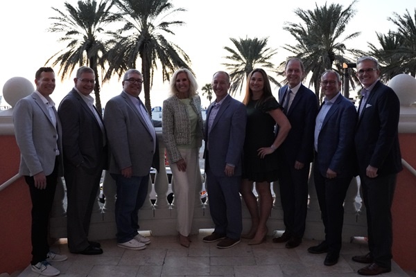 Fernand LeBlanc at far left with eight fellow Life Insurers Council advisory board members outdoors in Clearwater Beach