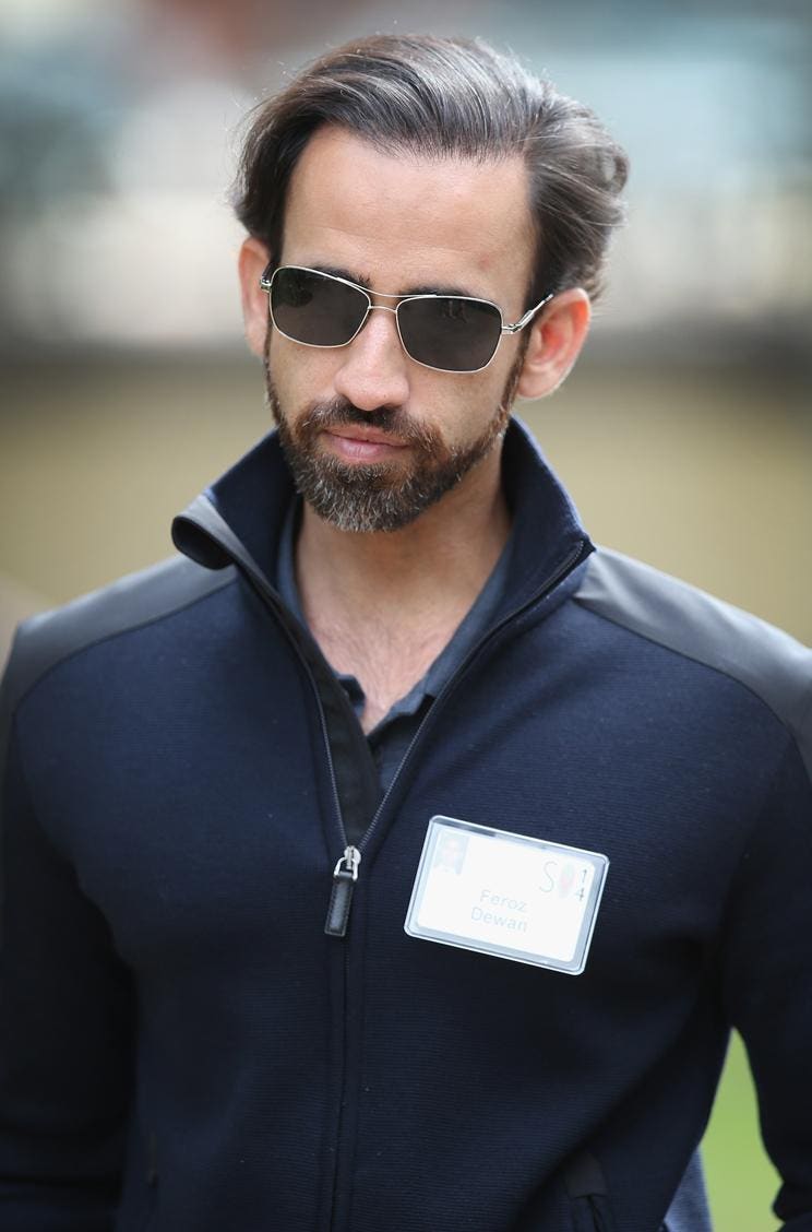 Feroz Dewan wearing sunglasses and a conference badge at Sun Valley in July 2014