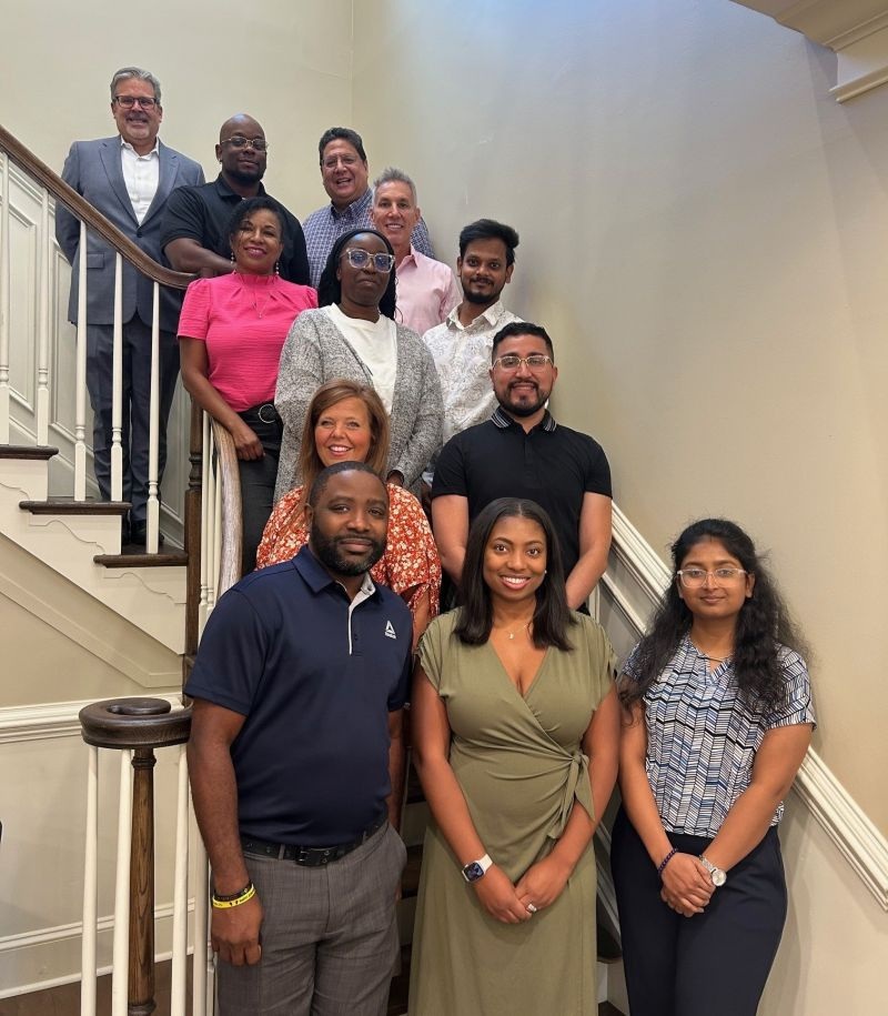 Ferrilli team members gathered on a staircase during training in Haddonfield