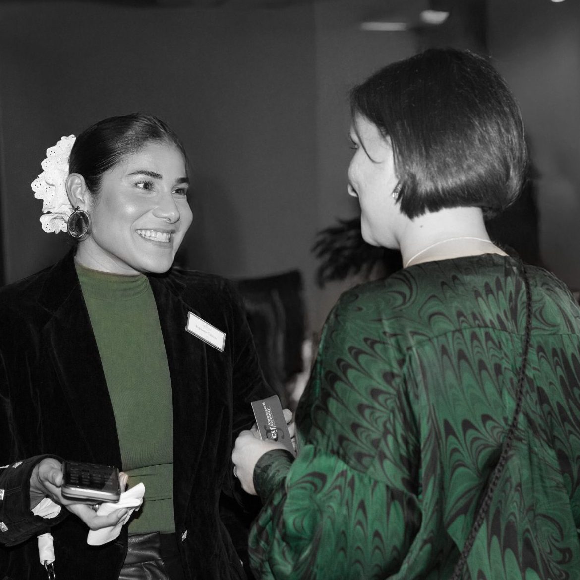 Two attendees talking at an event in FFinc’s official photography