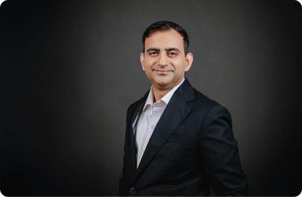 Fibe co-founder Akshay Mehrotra in a dark suit