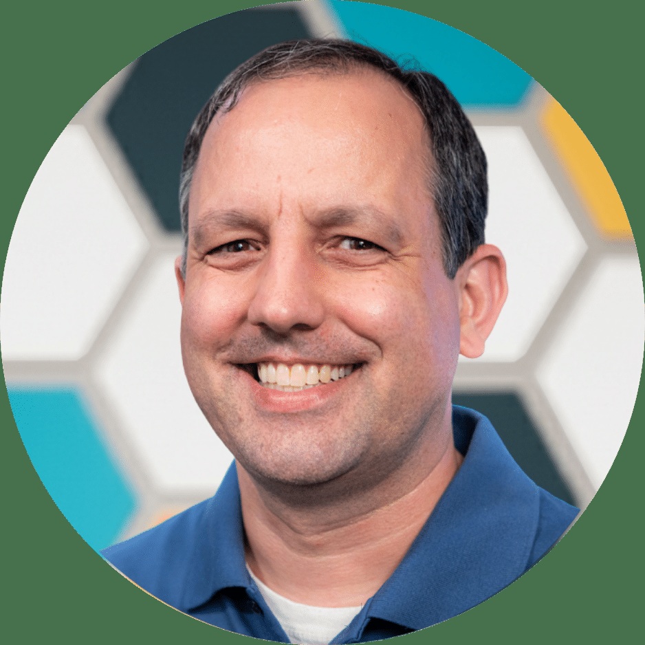 Findhelp founder Erine Gray smiling in his company portrait