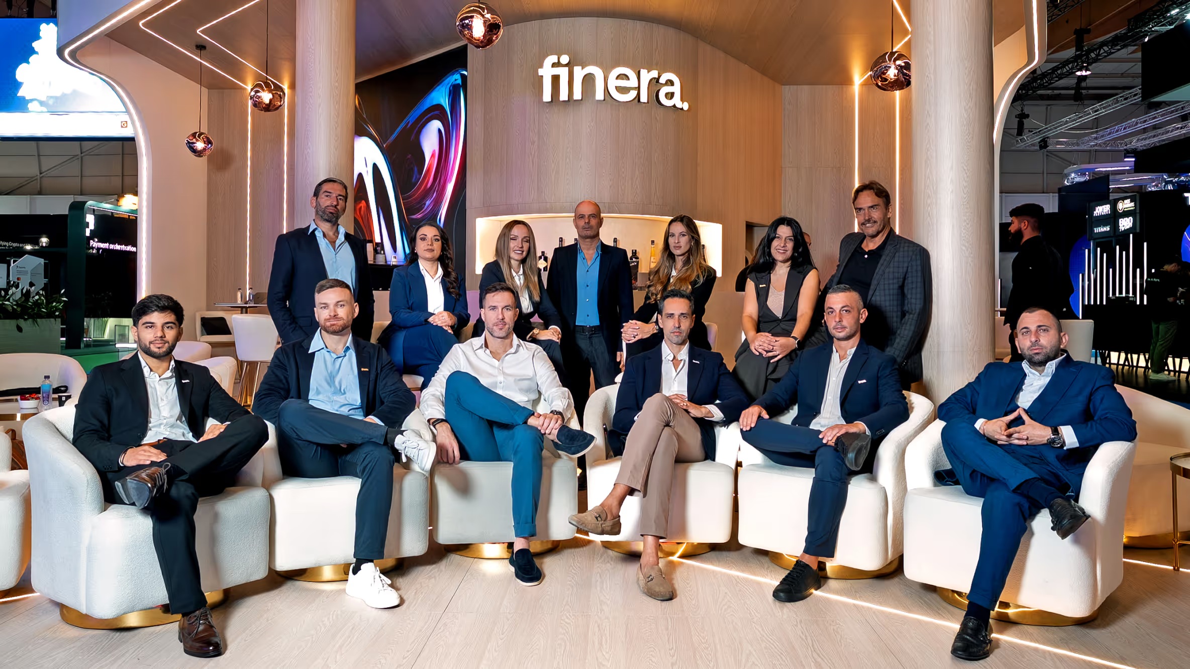 The finera team gathered at its exhibition stand at SBC Summit Lisbon 2025