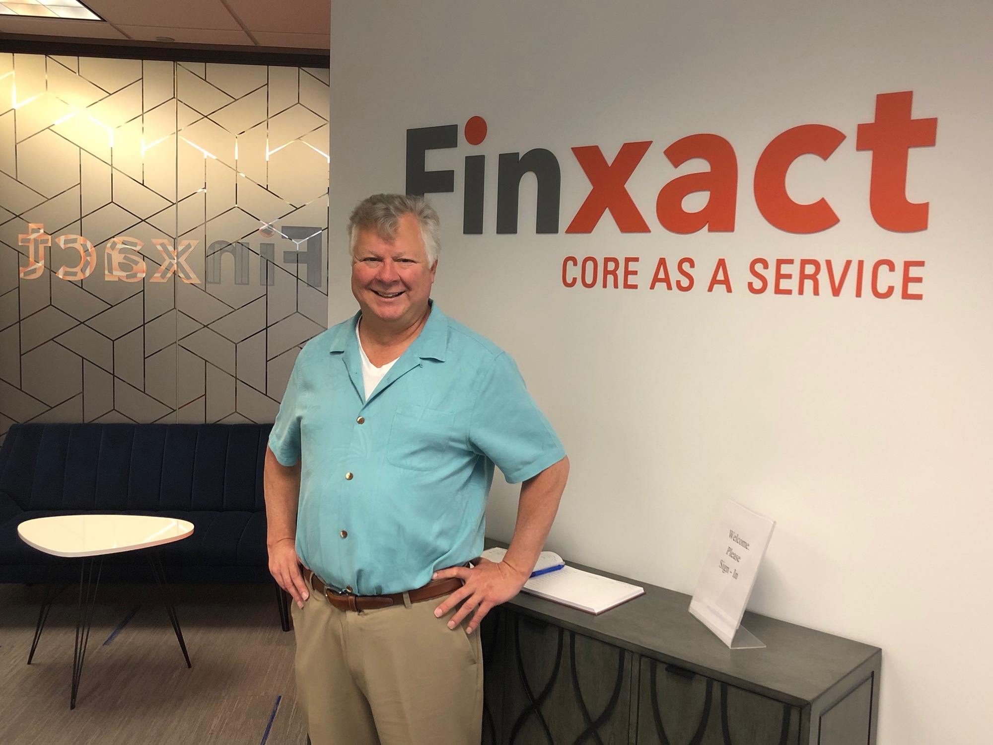 Co-founder Frank Sanchez standing in Finxact’s Jacksonville office